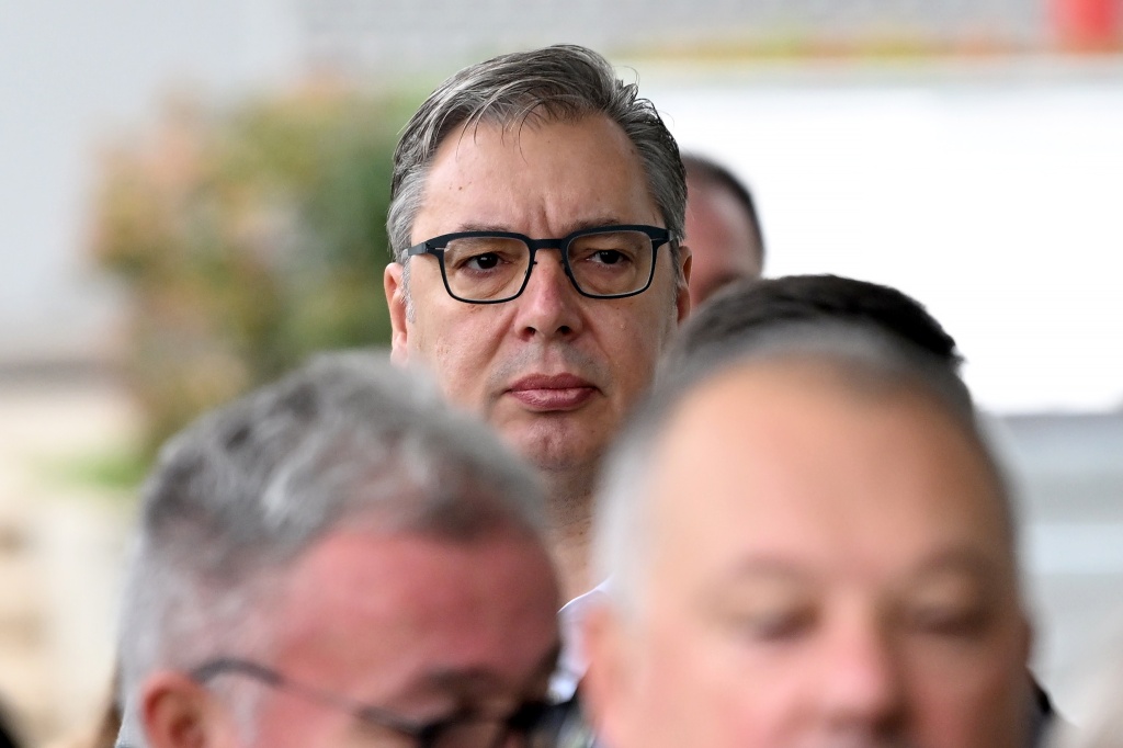 Former Serbian president Aleksandar Vucic (C), the Serbian Progressive Party (SNS) candidate for prime minister, waits in line to cast his ballot — Marko Ljutica / AFP