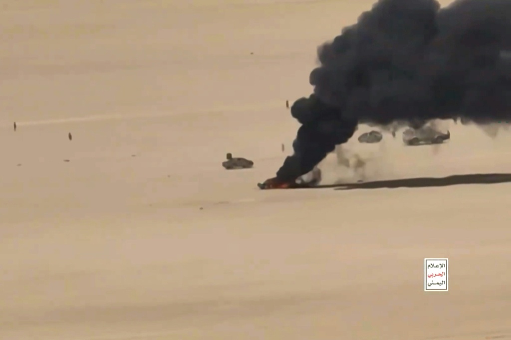 This screen grab taken from video footage released by Ansarullah Media Centre on October 5 shows an aerial view of a burning vehicle during what the Houthis say are drone attacks on Yemeni government forces — Handout / AFP