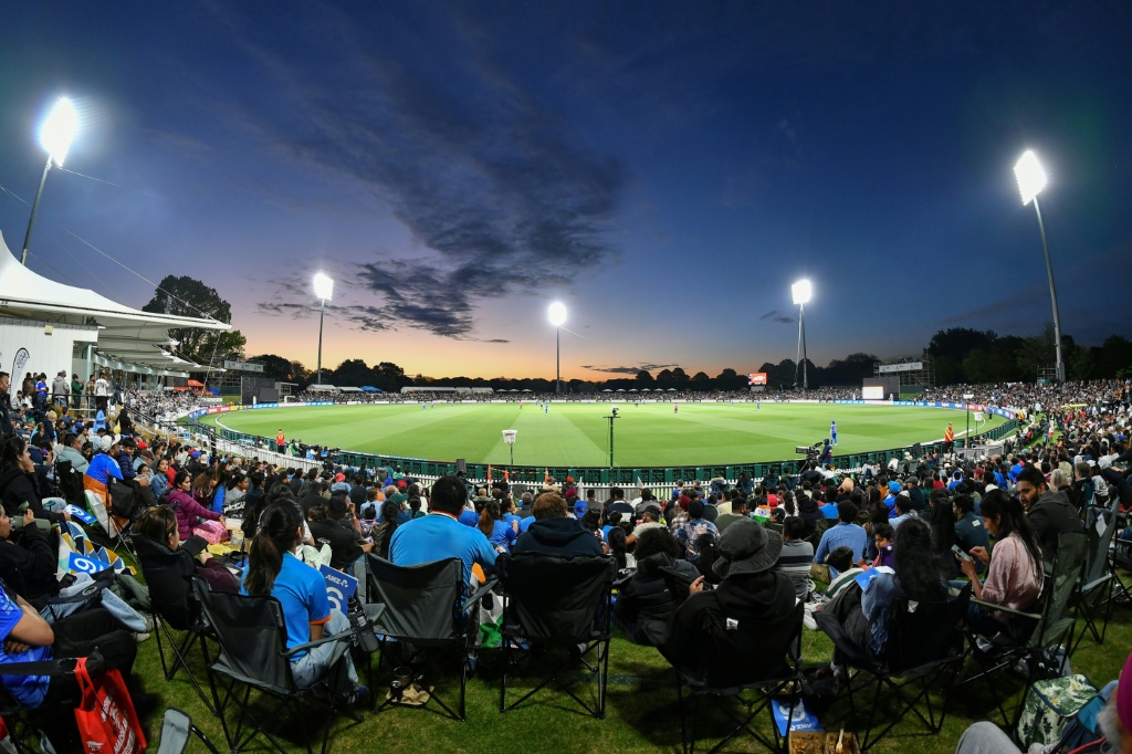 Fans watch the first Twenty20 international cricket match between New Zealand and India at Hagley Oval in Christchurch on October 22, 2026. — Sanka VIDANAGAMA / AFP