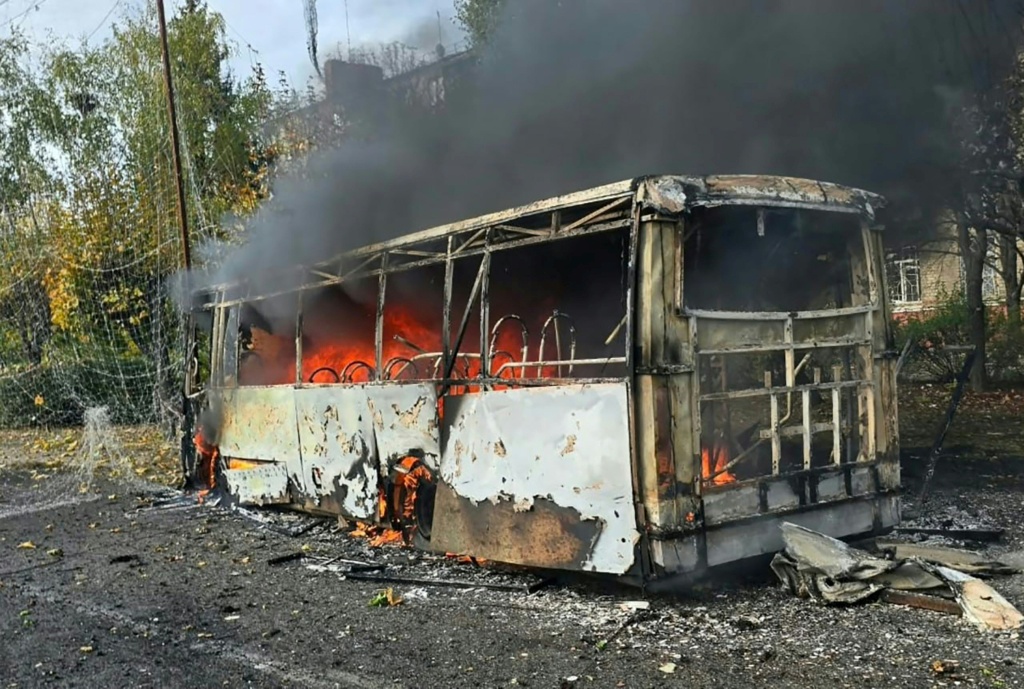 This handout photograph taken and released by the Donetsk Region Prosecutor's Office on October 8, 2026 shows one of the two passenger buses struck by projectiles in Kramatorsk, near the frontline in eastern Ukraine — Handout / AFP