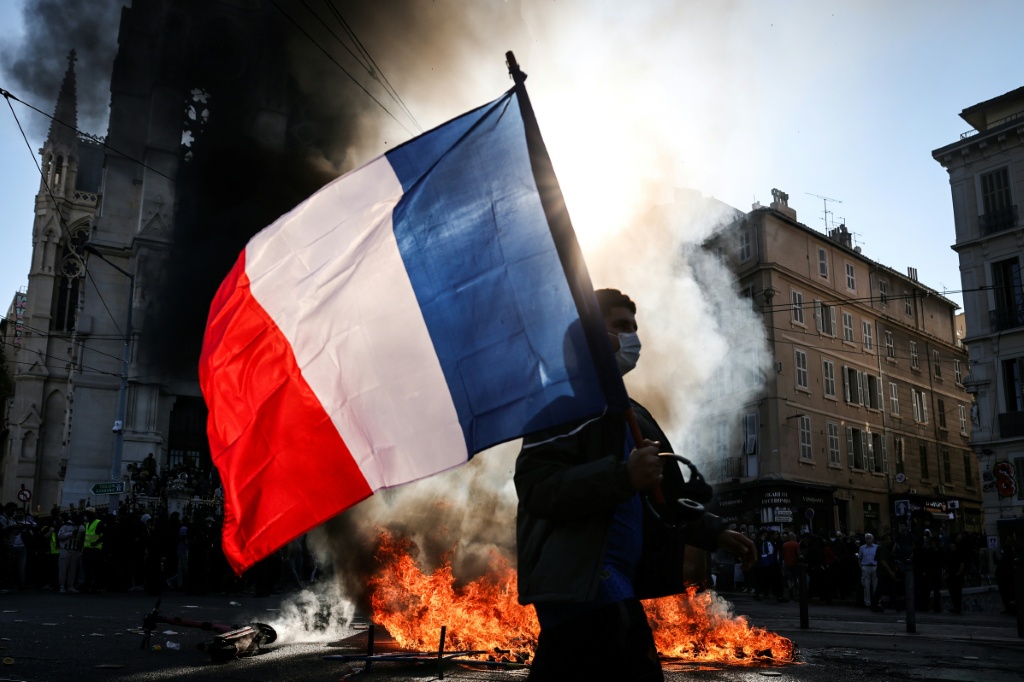 The Elysee said Macron would visit Marseille City Hall which was affected by the violence on October 17 — Thibaud MORITZ / AFP