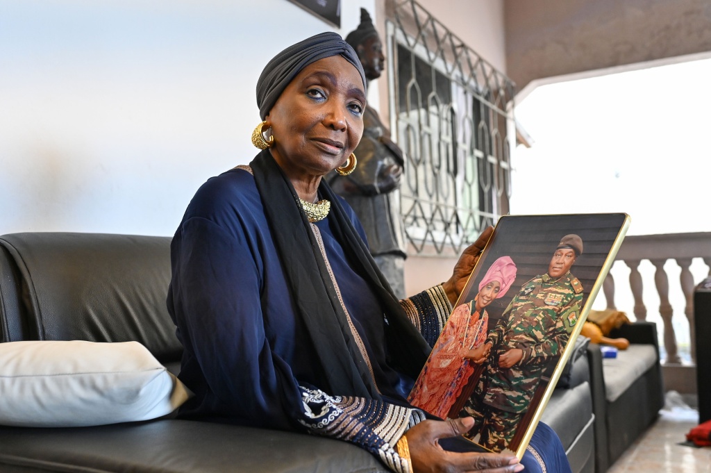 Ivorian diva Aicha Kone, shown holding a photo of herself with Niger's leader General Abdourahamane Tiani, is a Sahel junta supporter — Issouf SANOGO / AFP