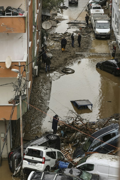 The floodwaters were so strong they swept vehicles away — BERK OZKAN / AFP