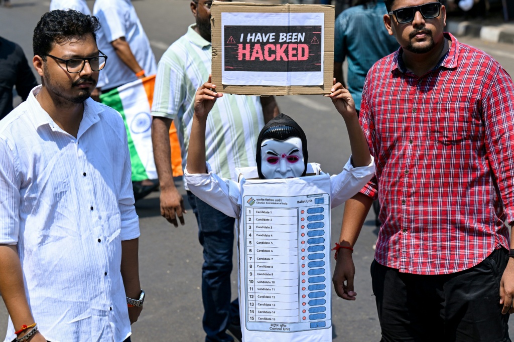 Protesters carry placards during a demonstration calling for the resignation of India's Chief Election Commissioner Gyanesh Kumar — Punit PARANJPE / AFP