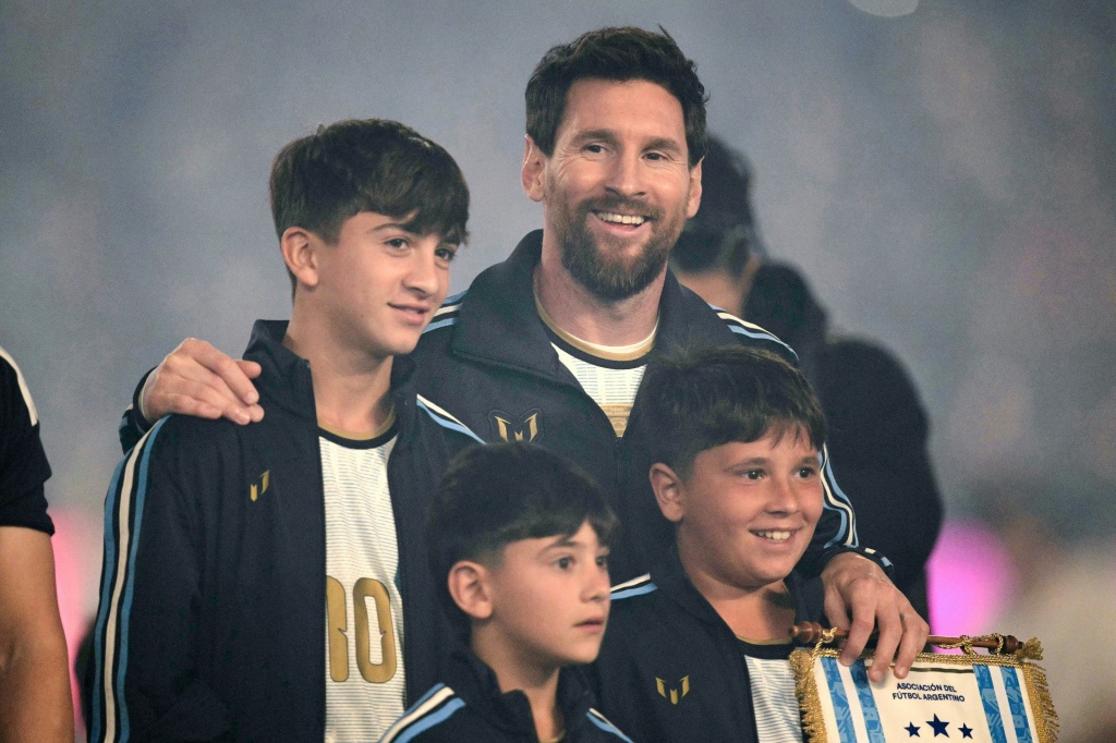 Is it in the genes? Will one of superstar Lionel Messi's sons Thiago (L), Mateo (R) and Ciro (C) inherit his extraordinary talent — JUAN MABROMATA / AFP
