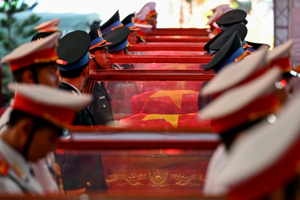 Vietnam held funeral rites for more than 700 of its war dead on October 14, unearthed in a major push to identify those missing from decades of conflict with France and the United States — Nhac NGUYEN / AFP