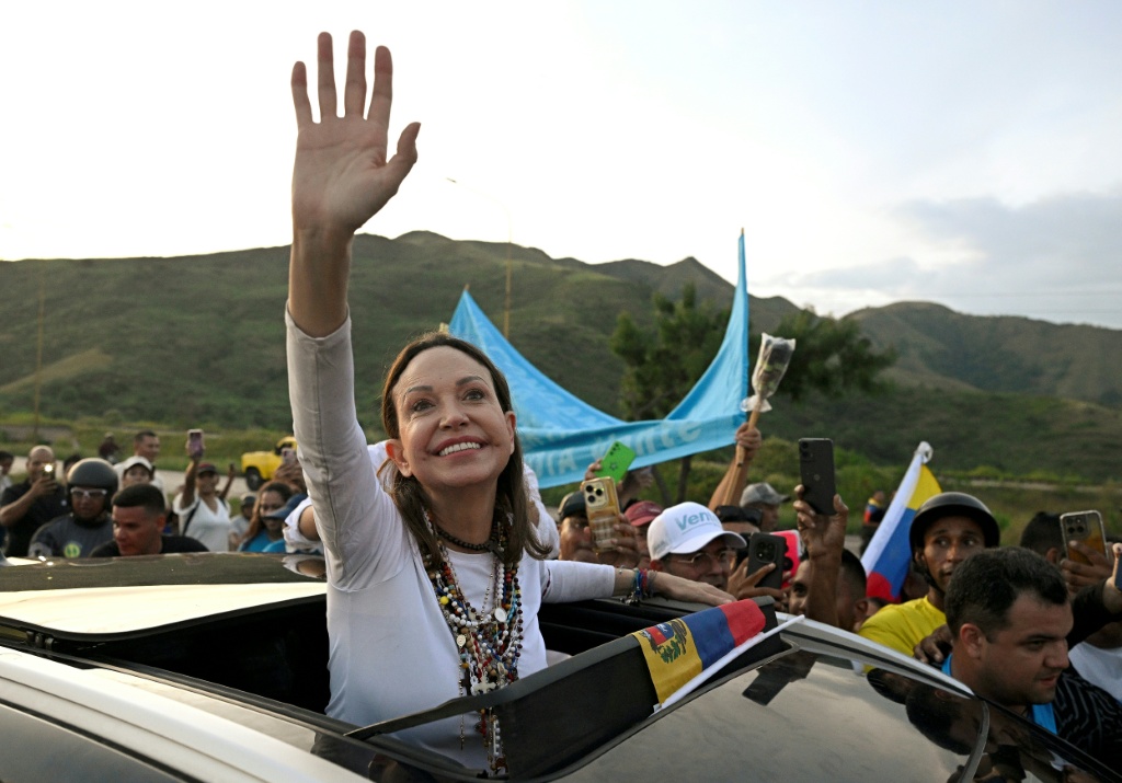 Venezuelan opposition leader and Nobel Peace Prize laureate Maria Corina Machado greets supporters after her return from exile to her homeland — Federico PARRA / AFP
