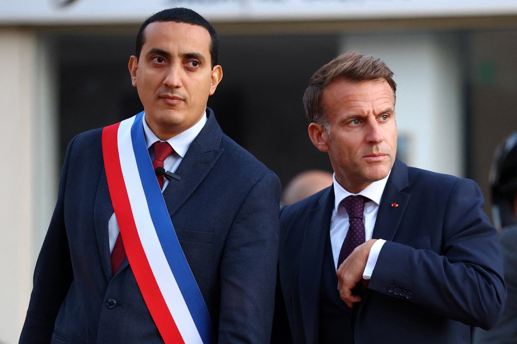 French President Emmanuel Macron visited Trappes, southwest of Paris, accompanied by mayor Ali Rabeh — Hannah McKay / AFP
