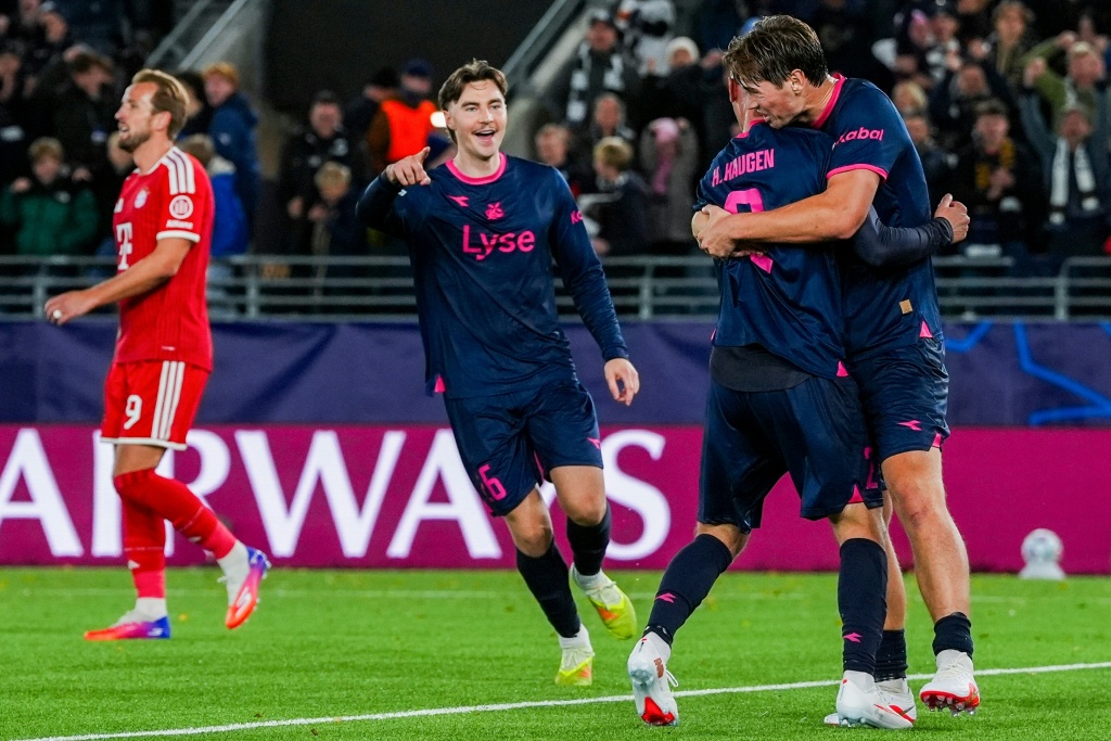 Viking defender  Herman Haugen receives an embrace after scoring his team's late equaliser against Bayern Munich — Lise Åserud / AFP