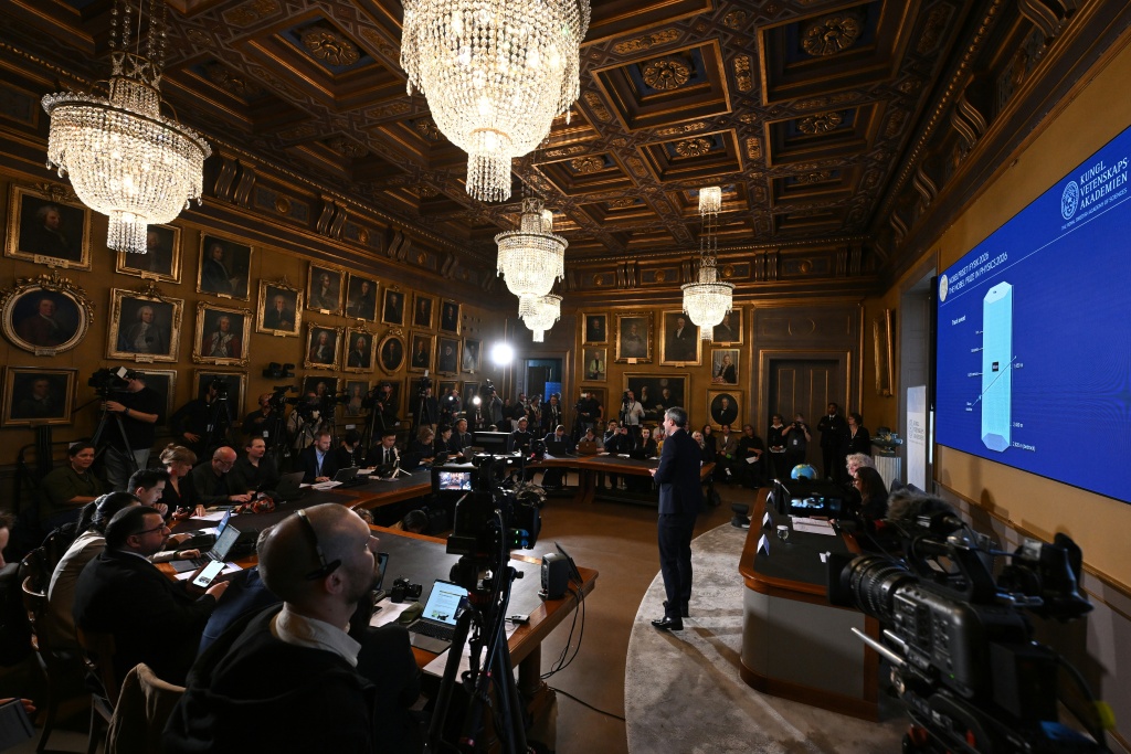 The Nobel committee presented Halzen's work at a news conference in Stockholm — Jonathan Nackstrand / AFP