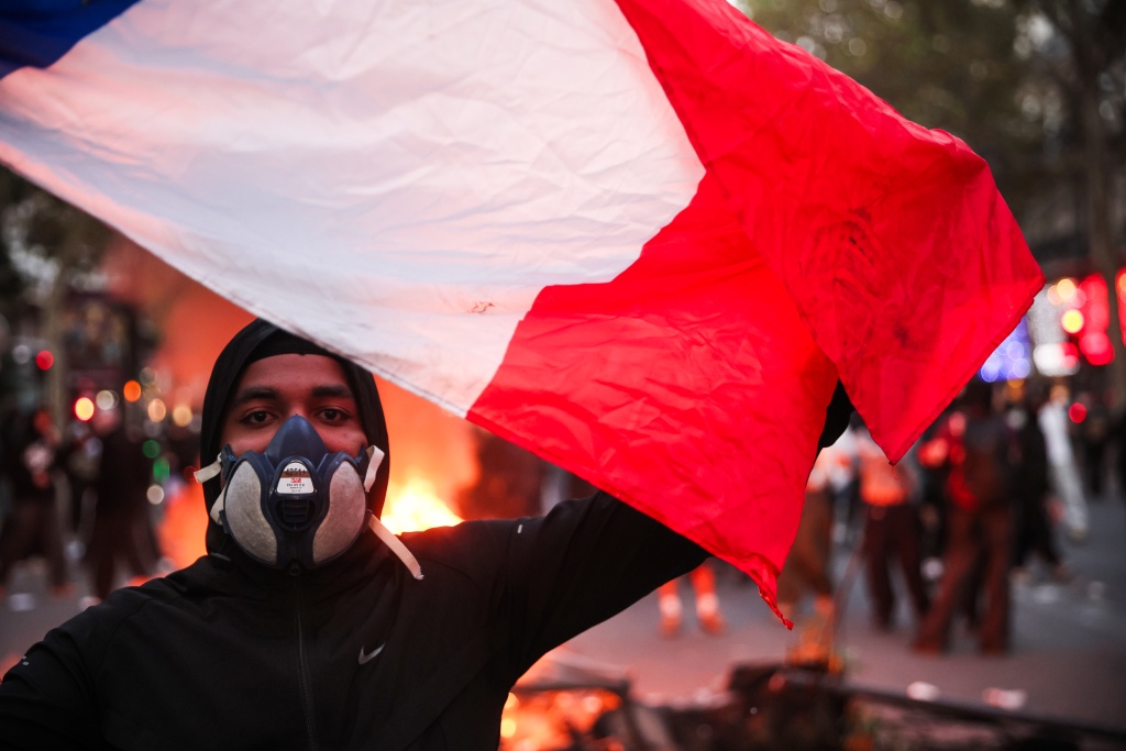 Masked youths clashed with police and looted stores on the sidelines of the demonstrations — Kiran RIDLEY / AFP