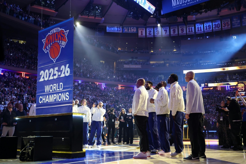 The New York Knicks see their NBA championship banner raised at Madison Square Garden before their season-opening game against the Philadelphia 76ers — Sarah Stier