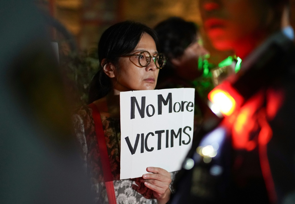 'We don't need US bases': Japanese protest after Marine held for murder