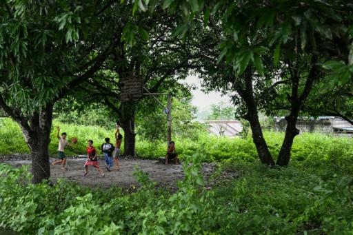 Children play basketball in Capas, Tarlac province — Jam STA ROSA / AFP