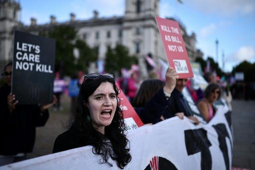 Opponents of the bill say it puts the disabled and elderly at risk of being pressured to end their lives — Henry NICHOLLS / AFP