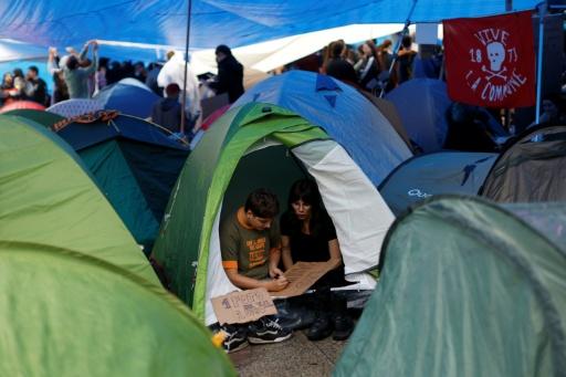 Madrid protesters braved the rain on Monday — Oscar DEL POZO / AFP