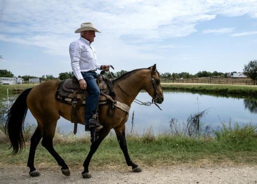 Texas Agriculture Commissioner Sid Miller, riding a horse at his ranch in Stephenville, Texas, disagrees with President Donald Trump's decision to import ground beef to ease consumer prices — RONALDO SCHEMIDT / AFP