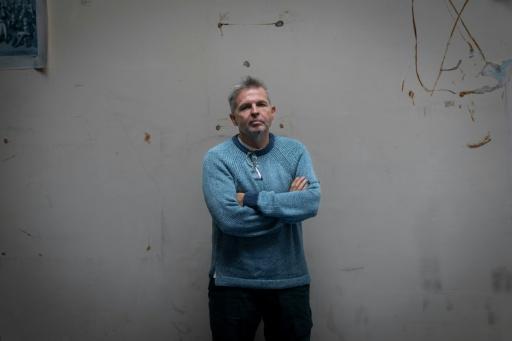 Badanin (pictured) and colleague Mikhail Rubin wrote a taboo-breaking book about Putin — Kiran RIDLEY / AFP