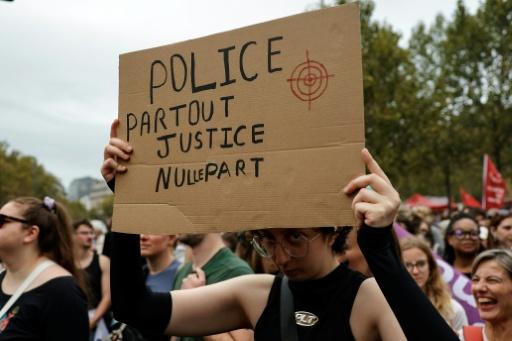 'Police everywhere, justice nowhere': many of the placards reflected mistrust of the police — GEOFFROY VAN DER HASSELT / AFP