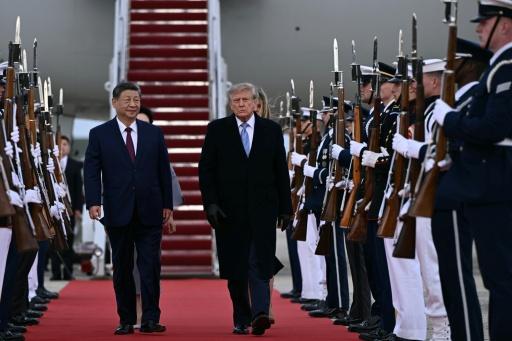 US President Donald Trump gave Chinese President Xi Jinping a rare personal airport welcome — Brendan SMIALOWSKI / AFP