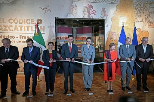 Mexican and French officials, historians and museum chiefs cut a ceremonial ribbon to open an exhibition featuring the Codex Azcatitlan, an ancient Aztec pictorial manuscript on loan from France, at the Anthropological Museum in Mexico City — Carl de Souza / AFP