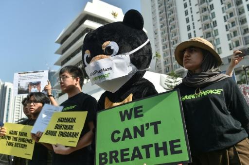 Activists gathered in front of the Indonesian embassy in Kuala Lumpur to submit an official memorandum calling for transparency and corporate accountability — Arif Kartono / AFP