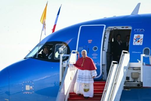 Church bells rang around the nation when the first US pontiff landed outside Paris — Alberto PIZZOLI / AFP