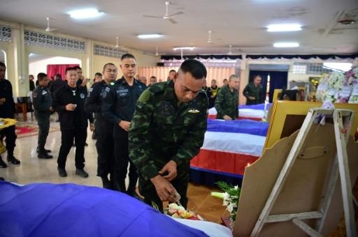 Thai soldiers pay respects to comrades killed at a checkpoint in Thailand's restive south in July — Madaree TOHLALA / AFP