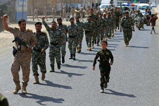 Fighters loyal to the Houthis march during a rally to recruit more fighters — Mohammed HUWAIS / AFP
