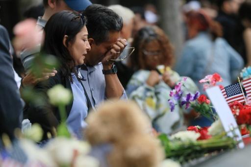 People shed tears at the 9/11 remembrance ceremony at Ground Zero in New York — Spencer Platt / AFP